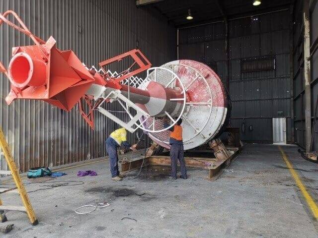 Barnacles and marine growth blasted off a propeller shaft and rudder