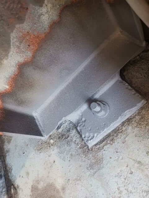 Metal surfaces cleaned with wet abrasive blasting on a pallet