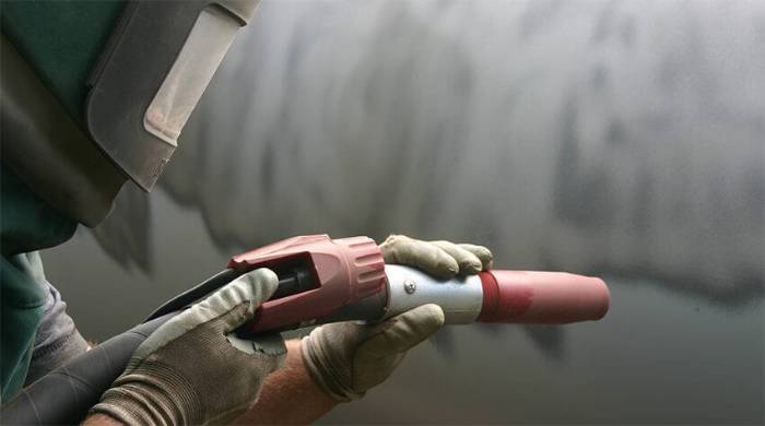 Brick wall, tag removed Graffiti being removed from a brick wall in Perth by wet abrasive blasting