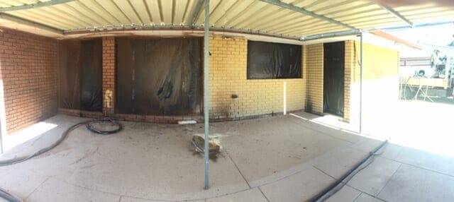 Painted limestone and brick wall stripped inside a Perth warehouse