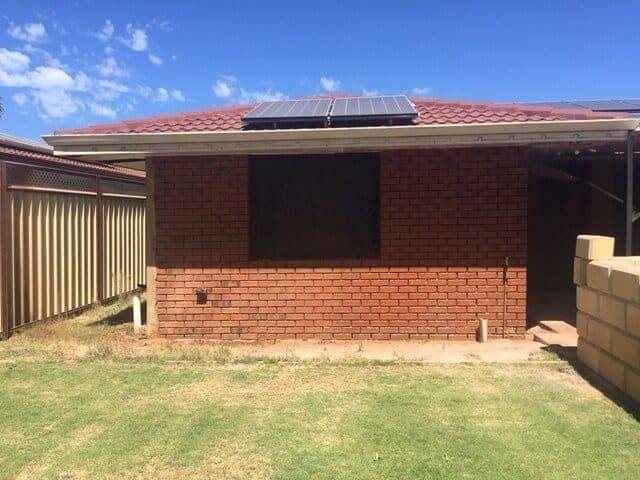 Painted brick boundary fence in Perth before blasting