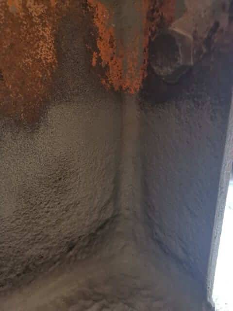 Rust and scale removed from a structural steel base plate