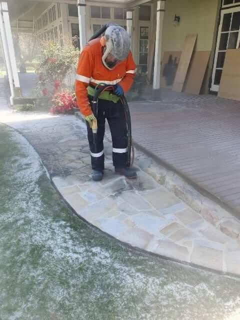 Sandstone and brick restored with low pressure wet blasting