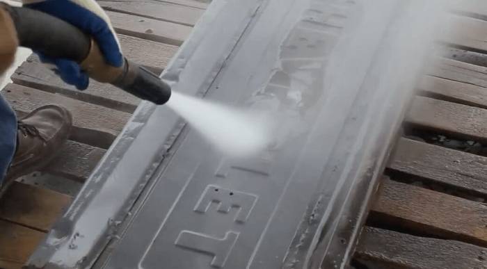 Structural steel beam blasted back to clean metal before assessment