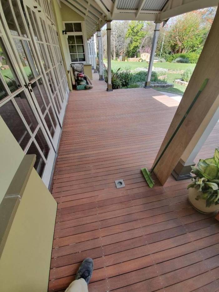 Timber decking boards stripped of grey weathering and old oil